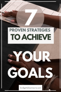 A close-up of a woman's hands writing in a planner, overlaid with bold text that reads '7 Proven Strategies to Achieve Your Goals,' promoting goal-setting and productivity tips on bridgetsbloomzone.com.