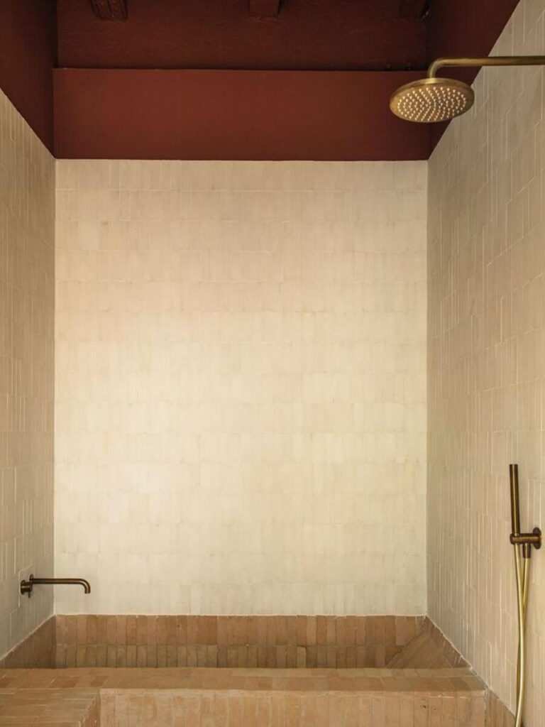 Beige walls and terracotta ceiling create soft, inviting small bathroom color ideas, ideal for cozy Bathroom Color Palettes with a modern twist.